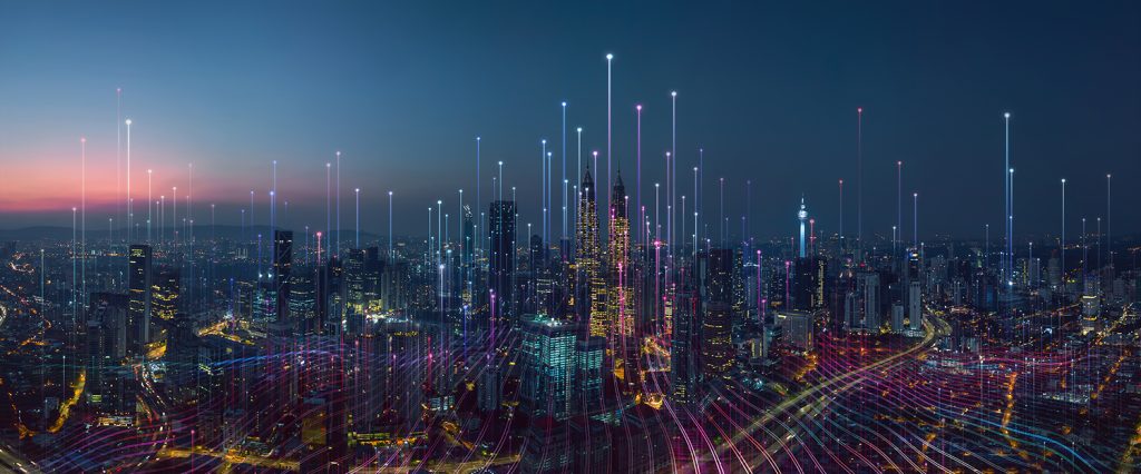 A vibrant city skyline at dusk, illuminated by colorful lights and digital lines creating a futuristic atmosphere.