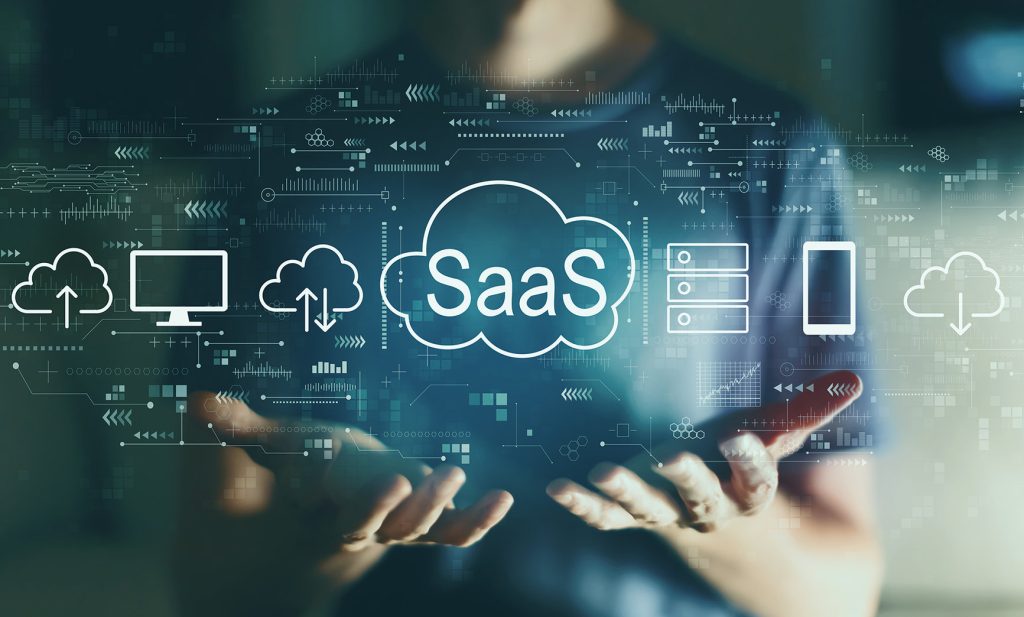 A person holds hands outwards with digital representations of technology and cloud services, featuring the term 'SaaS' prominently.