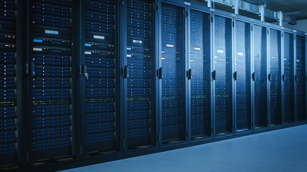 A row of server racks illuminated by blue lights, showcasing a modern data center environment.