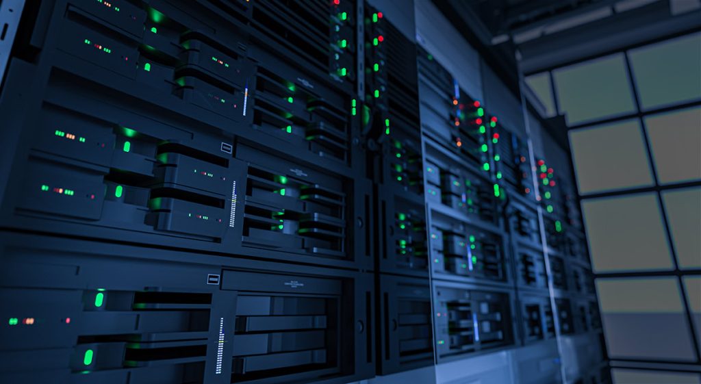 A close-up view of server racks with illuminated indicators, showcasing a modern data center environment.